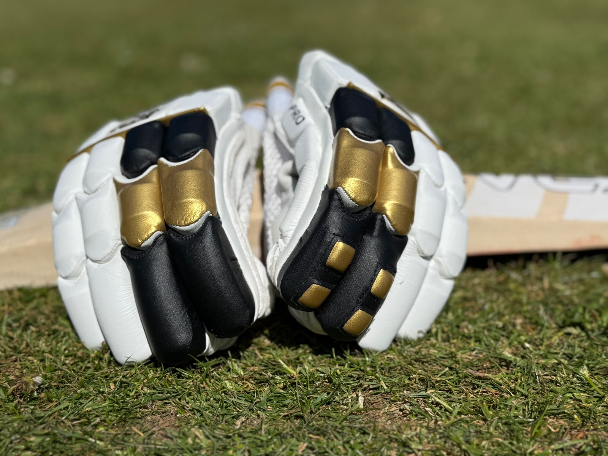 Kraze pro black gold resting on a bat