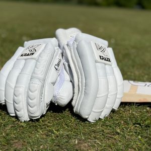 Kraze premium test gloves resting on a bat