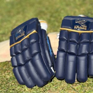 Kraze premium gloves resting on a bat